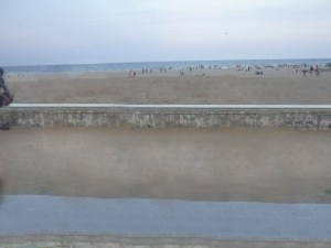 A view from the walkway. The parapets, the sand and the ocean. 