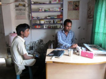 4 - Gurpreet tending to a patient, while the brother is away.