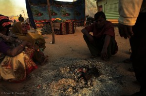 A woman passed away overnight due to exposure to the elements, her story has been picked up by a number of news agencies. The family huddled in the cold around warm embers in front of her shrine. “She died because she had to sleep out in the cold. They took her house away.” One family member explained