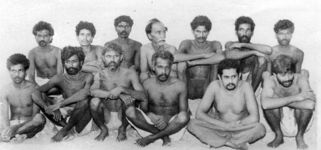 [This June 19, 1993 photo shows Veerapan aides Simon (front row, second from left) and Madaiah (fourth from left) among other landmine blast accused. Courtesy The Hindu/PTI.]