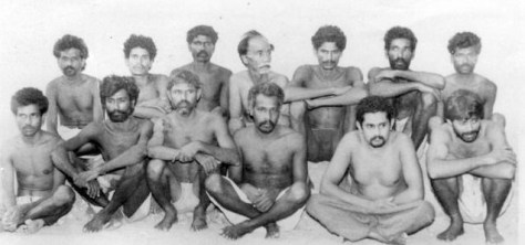[This June 19, 1993 photo shows Veerapan aides Simon (front row, second from left) and Madaiah (fourth from left) among other landmine blast accused. Courtesy The Hindu/PTI.]