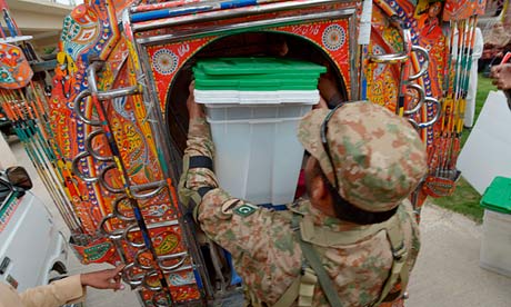 A Pakistani soldier loads ballot boxes into a van in Rawalpindi. Authorities hope the app, combined with a fully revised voter list and an unprecedented level of public scrutiny, will help ensure the election will be the cleanest ever. Photograph: Farooq Naeem/AFP/Getty Images