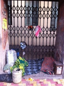 A footpath dweller neatly carves out space