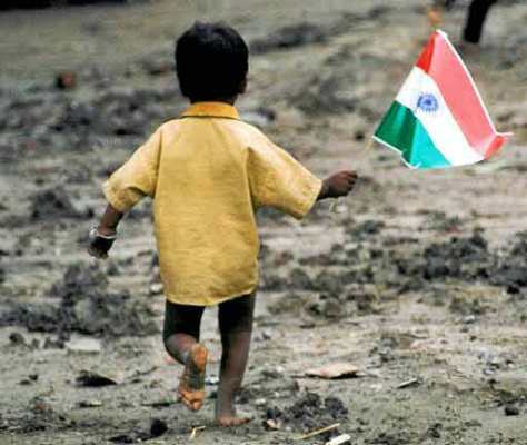 A-homeless-young-boy-waves-the-Indian-flag