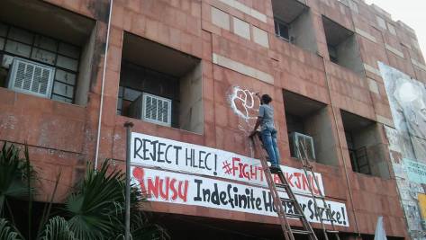 Students from Jamia Millia Islamia University painting signs and graffiti in support of the JNU students on Hunger Strike